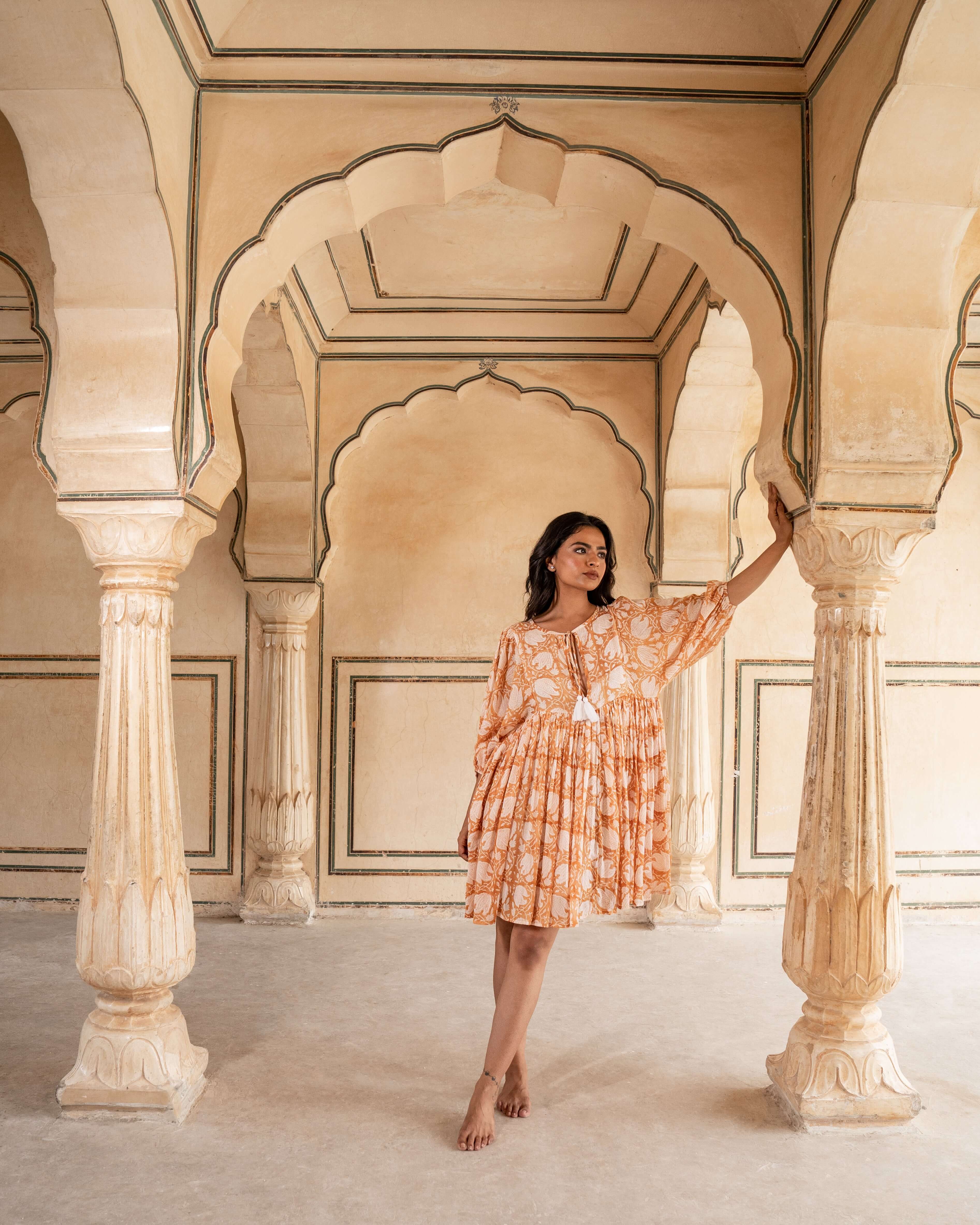 Caramel cotton midi dress with stunning floral patterns, perfect for a laid-back yet stylish look for any day of the week.