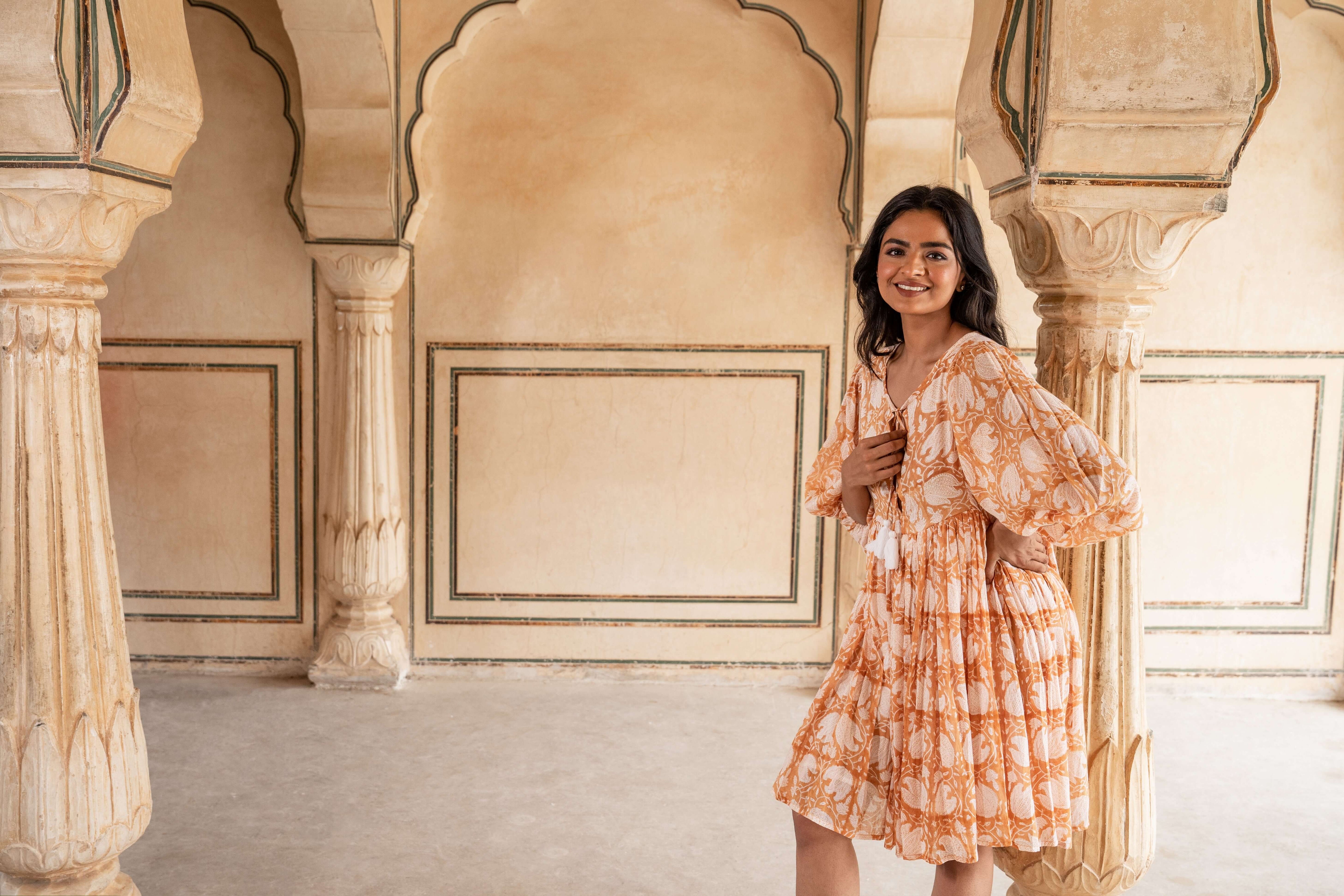 Comfortable caramel floral midi dress made of soft cotton, offering a flattering silhouette for casual outings or special occasions.