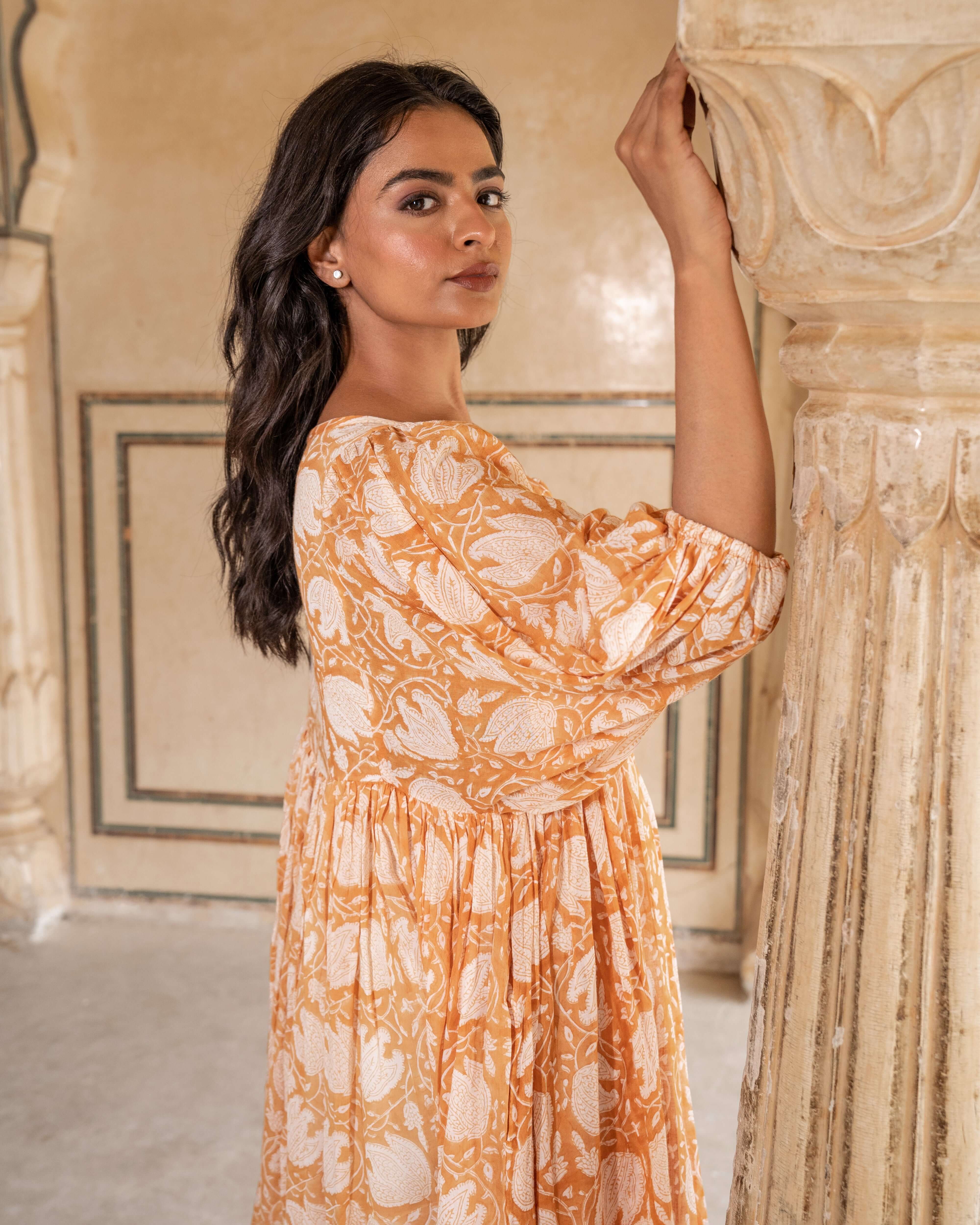 Floral cotton midi dress in warm caramel tones, designed for effortless elegance and comfort, perfect for your go-to summer outfit.