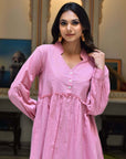 Stylish mauve pink cotton midi dress, offering comfort and effortless elegance for casual or semi-formal outings.