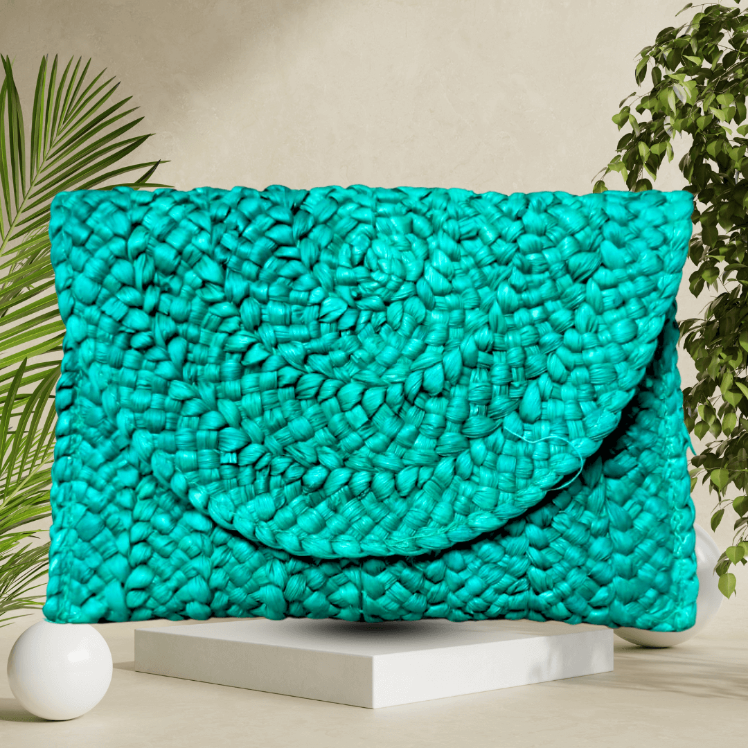 Elegant blue handmade straw clutch bag with intricate craftsmanship, perfect for adding a pop of color and style to any outfit.