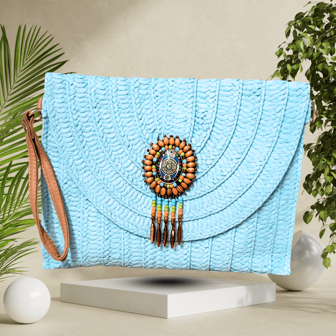 Eco-friendly straw clutch with detachable strap, woven design, and secure magnetic closure, perfect for adding charm to any outfit.