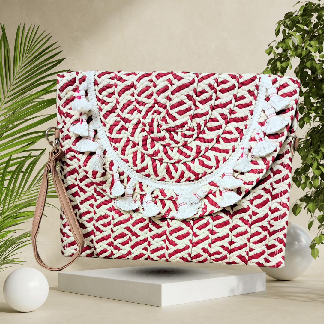 Handcrafted straw clutch with a detachable strap, eco-friendly woven design, and secure magnetic closure, adding a touch of sustainability to your look.