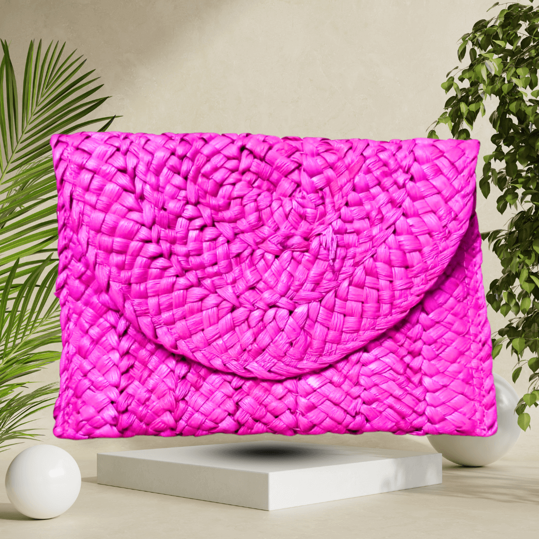 Stylish pink handmade straw clutch bag, a beautifully crafted accessory that adds a playful and charming accent to any outfit.