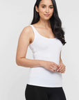 "Eco-friendly bamboo women's clothing: White singlet offers luxurious softness and chic simplicity."