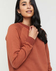 "Comfortable bamboo women's clothing: Rust jumper offers buttery softness and eco-friendly fashion."