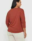 "Buttery soft bamboo women's top in rust: Sustainable style with a touch of elegance and comfort."