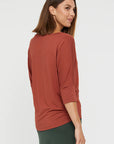 "Eco-friendly bamboo women's clothing: Rust top offers buttery softness and stylish sophistication."