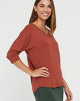 "Buttery soft bamboo top for women: Rust hue adds warmth and eco-conscious flair to attire."