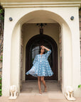 Beautifully handmade blue floral midi dress in soft cotton, featuring a flowy silhouette, relaxed sleeves, and front tie cord for a chic look.