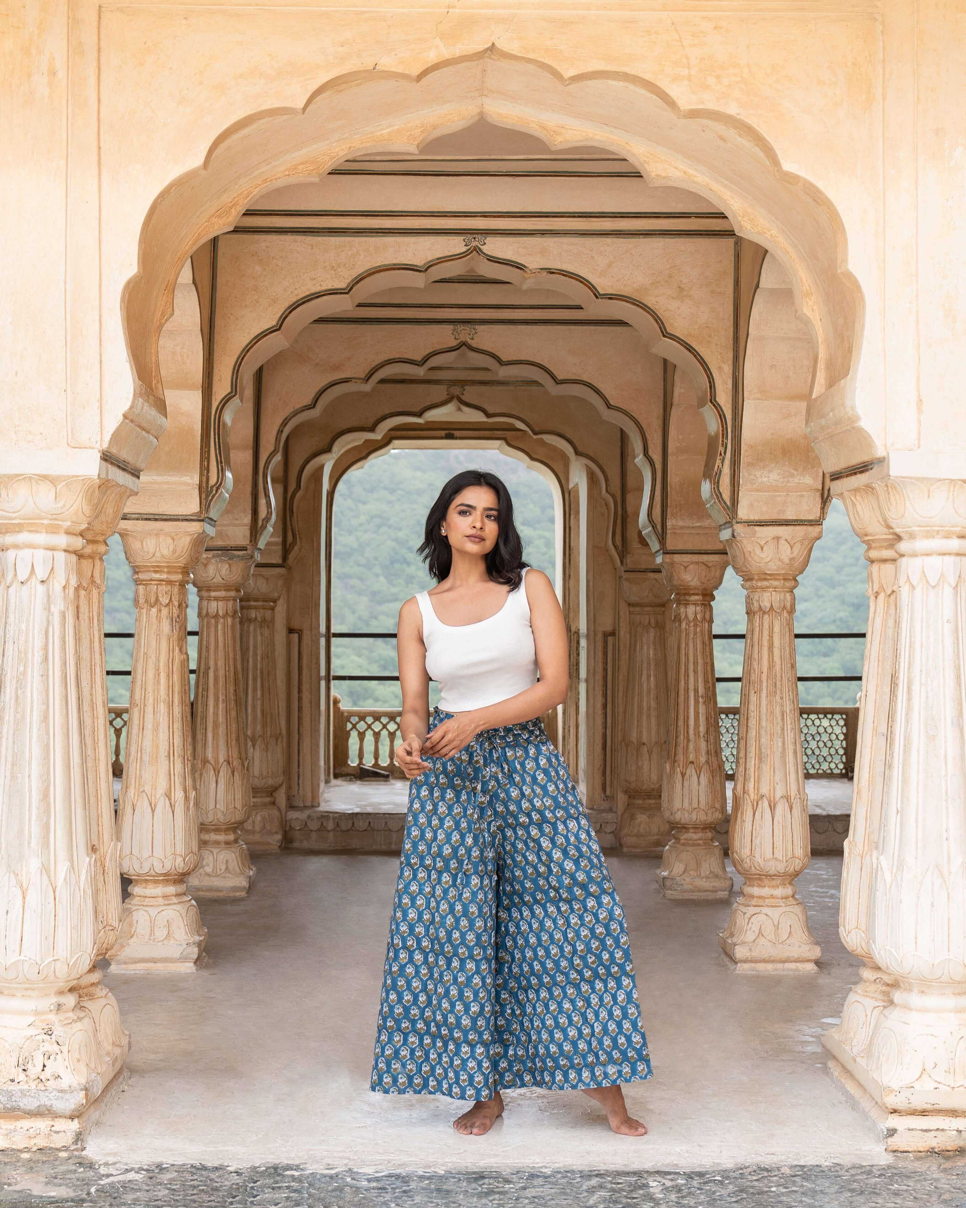 Versatile blue floral wide leg pants with an elastic waist and flowing silhouette, perfect for day-to-night wear and effortless chic.