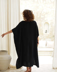 Experience the allure of our black cotton gauze kaftan. Unbeatable style, unmatched comfort.