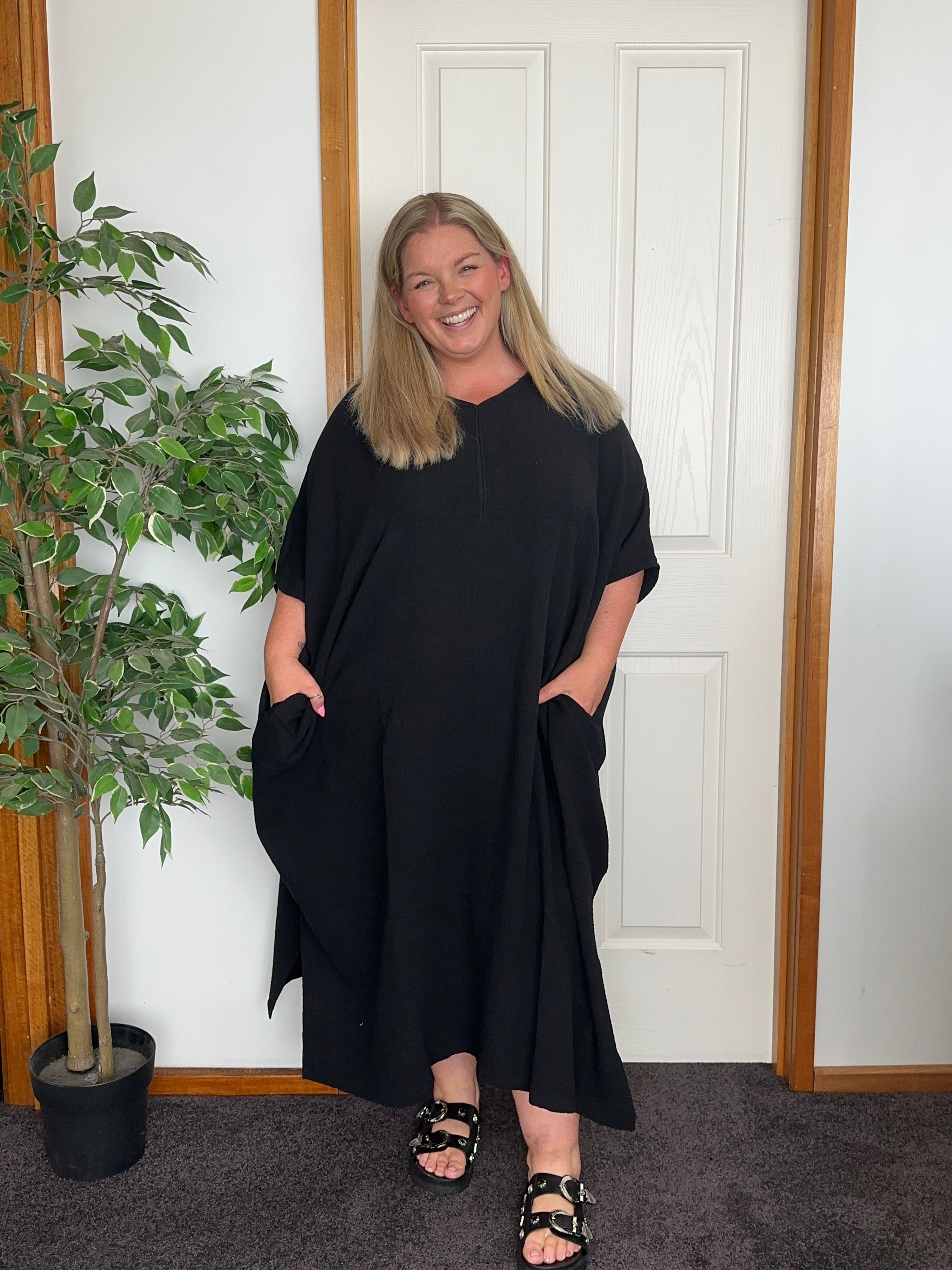 Elegant black cotton gauze long kaftan with a relaxed, flowy silhouette for a stylish and comfortable look.