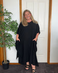 Elegant black cotton gauze long kaftan with a relaxed, flowy silhouette for a stylish and comfortable look.