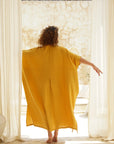 Make a statement in mustard: Our long kaftan in breathable cotton guaze. Effortless charm awaits!