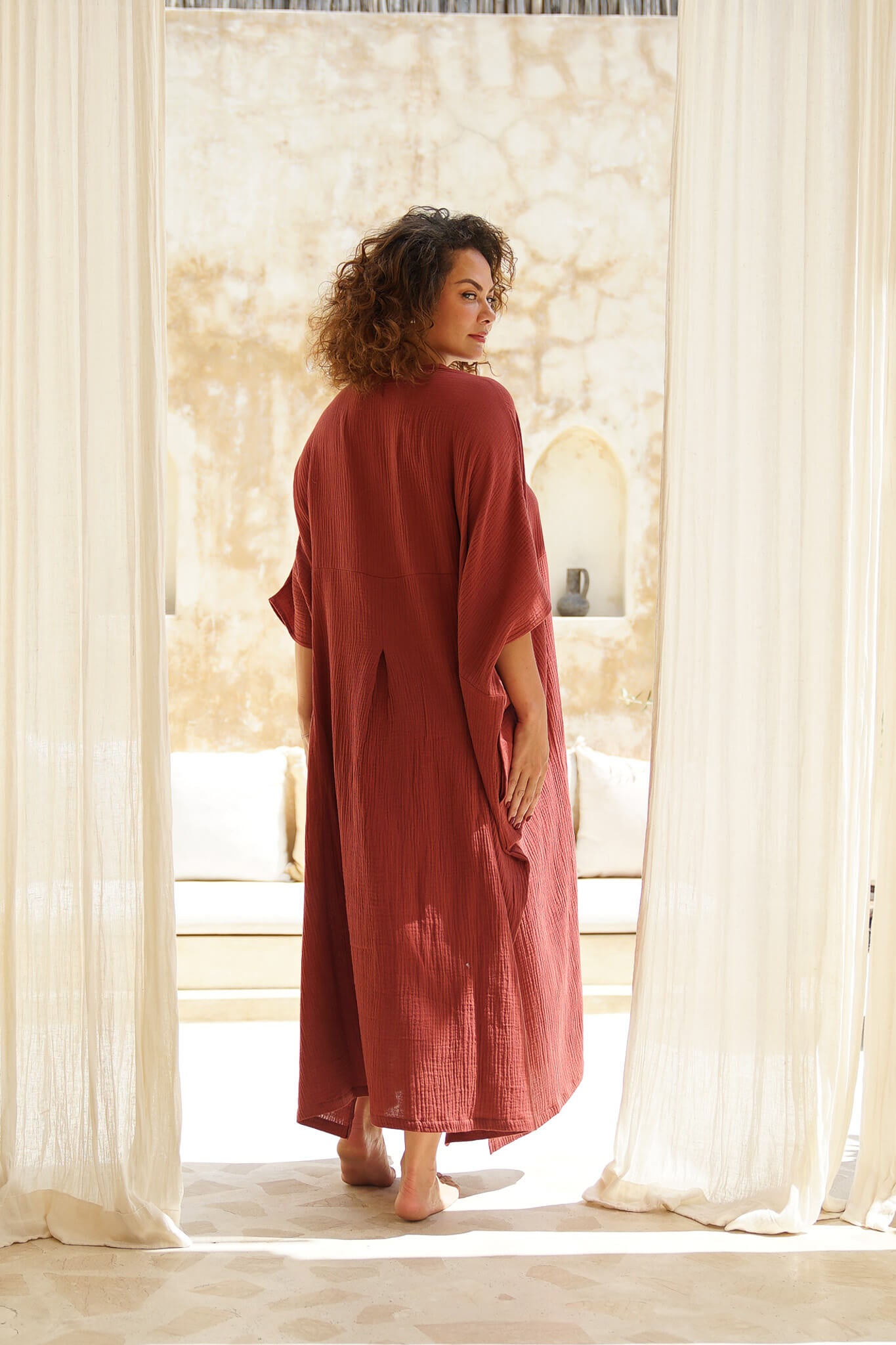 Indulge in luxe comfort with our Rust Long Kaftan in soft Cotton Gauze. Unmatched style, unparalleled comfort.