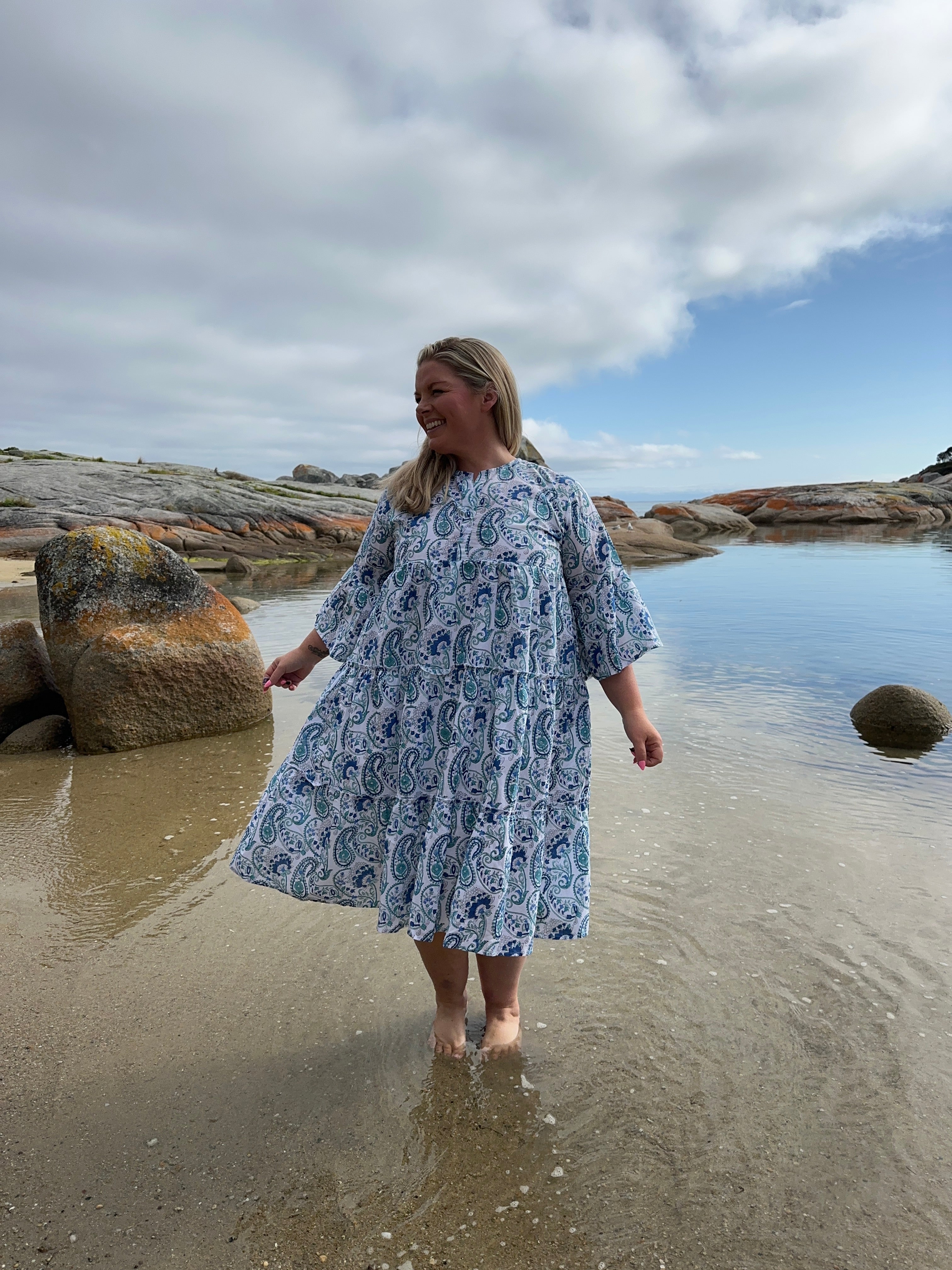 Light blue cotton midi dress with a relaxed fit and flowing skirt, perfect for casual wear.