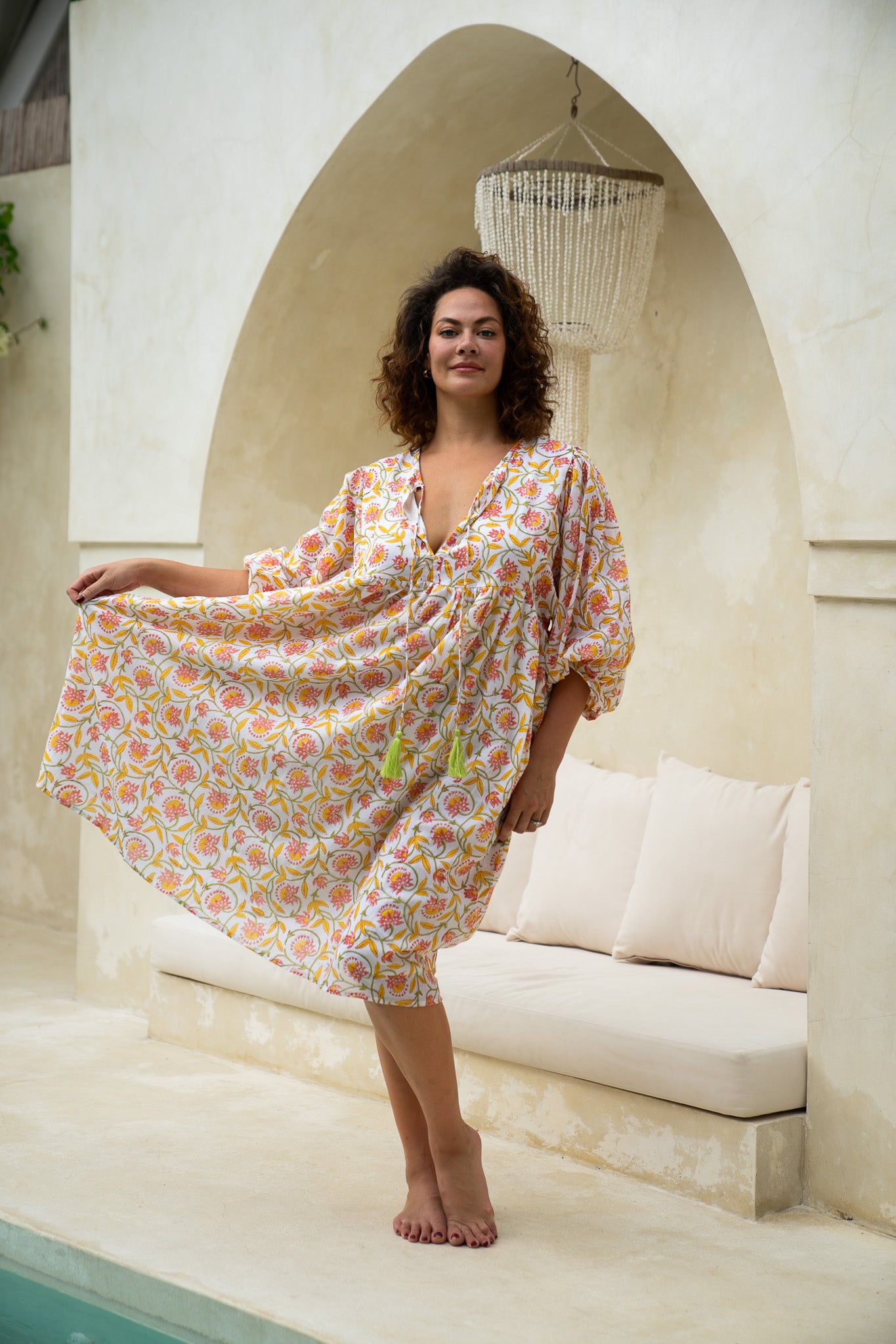 "Pincushion bloom cotton dress: Effortlessly chic and feminine, this midi dress is a must-have for your summer wardrobe."