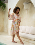 "Feminine cotton midi dress: Pincushion bloom print adds a touch of romance to your wardrobe, perfect for day or night."