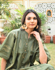 "Handmade shirt dress in cotton: Green and gold fusion, reflecting skilled craftsmanship and style."