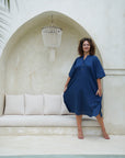 "Step out in style with our elegant blue long shirt dress. Flattering fit, timeless appeal. Shop the look now!"