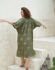"Make a statement in our stunning green long shirt dress. Flattering silhouette, irresistible charm. Buy yours today!"