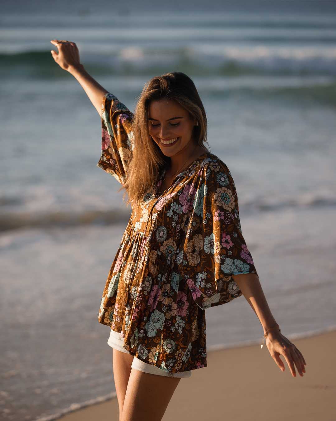 "Step into boho elegance with our brown floral top. Perfect for layering or wearing solo. Shop now for a top that complements any outfit!"