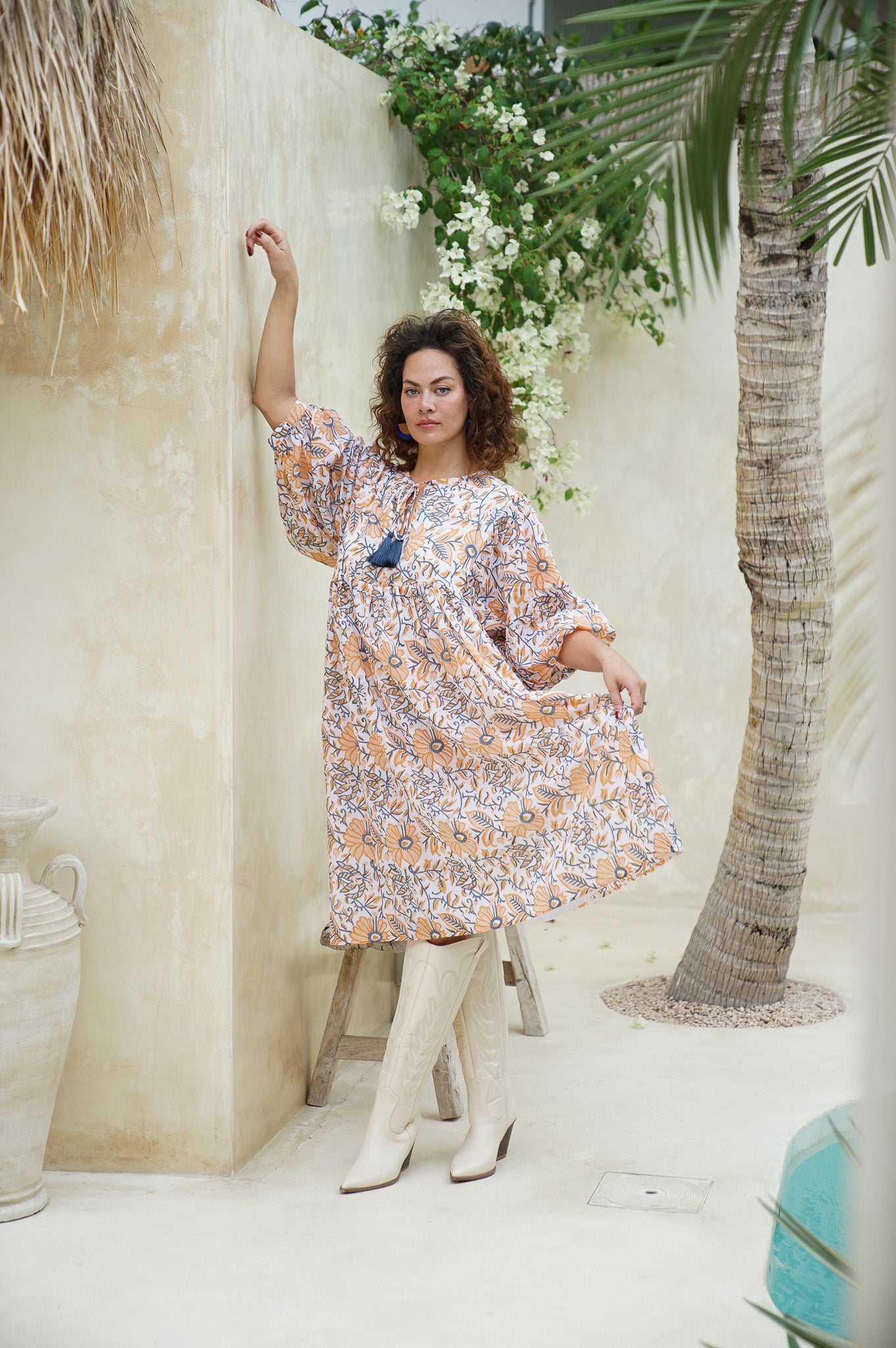 Embrace spring vibes in our cotton midi dress adorned with delicate florals. Elevate your wardrobe now!