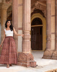 Timeless red floral wide leg pants with flared legs and practical pockets, offering both style and functionality for any occasion.