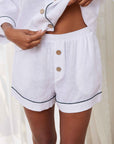 "Indulge in comfort: Treat yourself to the luxury of these stylish white linen women's pajamas, perfect for relaxation."