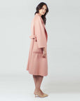 Stay chic and cozy in our Pink Blush Wool Coat. Unparalleled comfort meets timeless style.