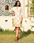 "Cotton midi dress featuring floral pattern: Long sleeves enhance the elegance of this attire."