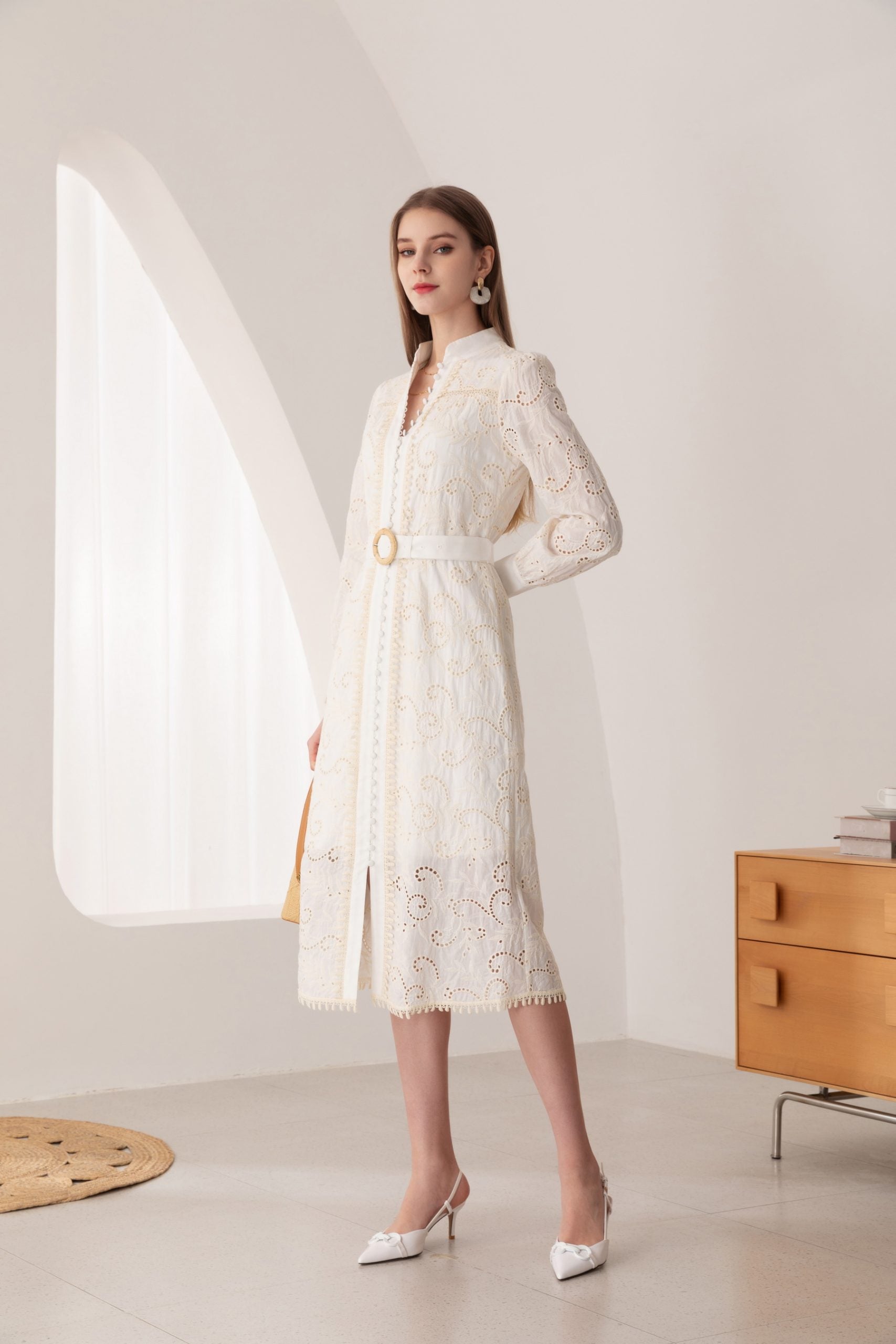 Turn heads in our Embroidered White Cotton Midi Dress. Effortless charm meets classic sophistication.