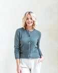 Wrap yourself in warmth: Pure Merino wool grey cardi, cozy chic for chilly days. Get yours now!