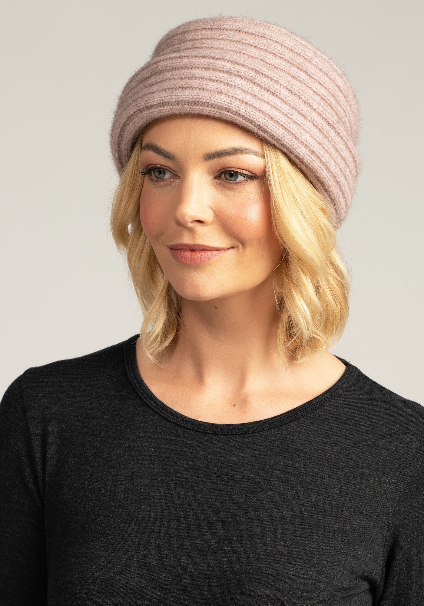Elevate your winter look with our Merino Knit Beanie in light pink. Luxurious warmth meets chic style. Order yours today!