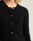 "Elevate your wardrobe with our black merino wool button-up cardigan. Unmatched comfort and elegance await!"