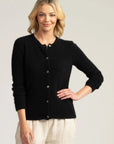 "Discover the perfect blend of comfort and class in our black merino wool cardigan. Button up for timeless style."