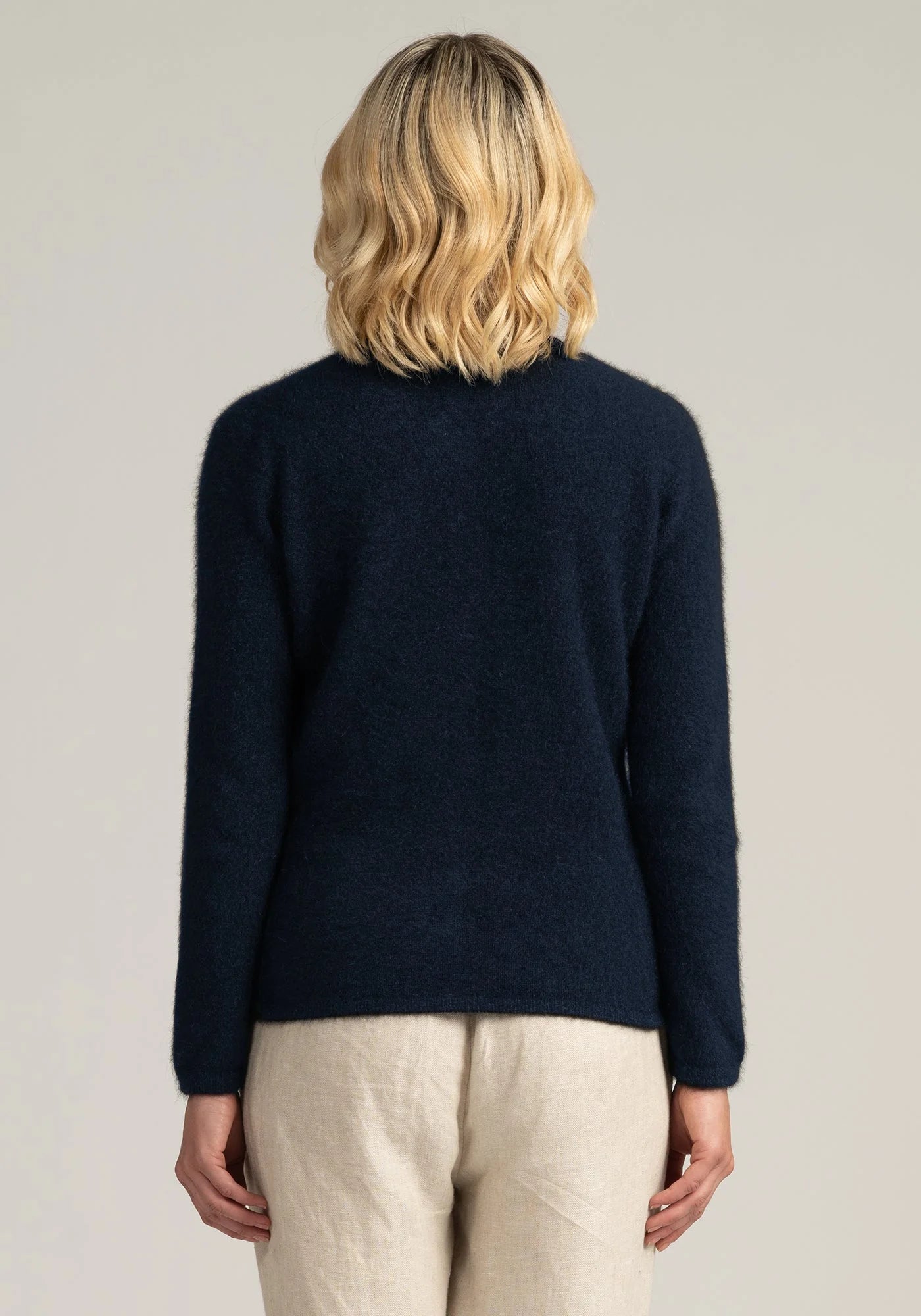 Our pure merino wool navy blue cardigan offers unparalleled comfort and style. Ideal for any season, any occasion. Shop now for premium quality!