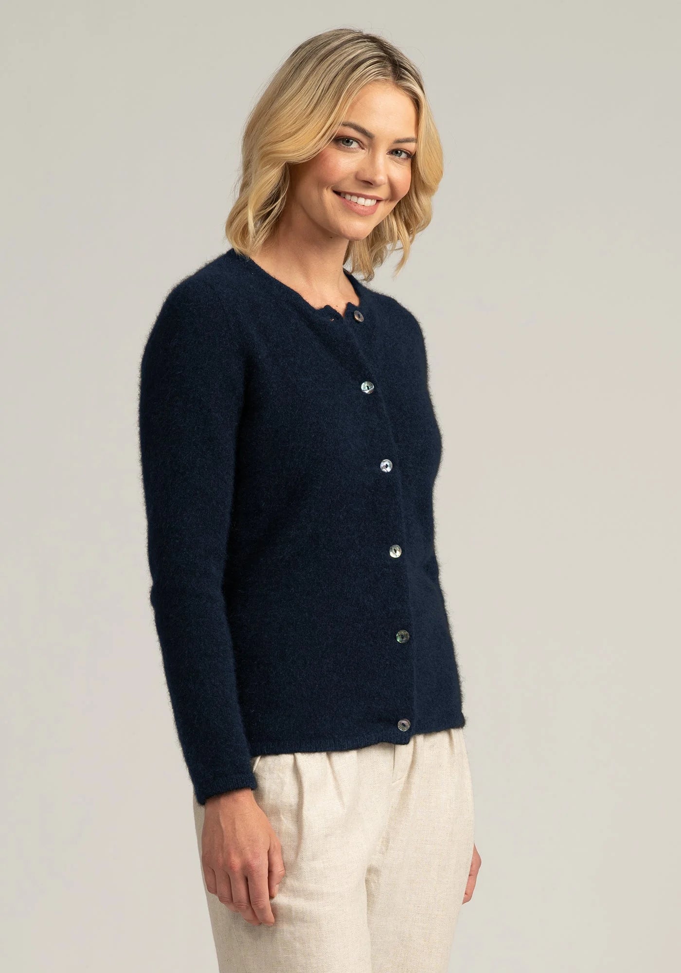 Indulge in luxury with our navy blue merino wool cardi. Perfect blend of warmth and sophistication. Limited stock—shop your size today!