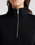 "Wrap yourself in warmth and sophistication with our black Merino wool zip collar sweater. Timeless elegance awaits."