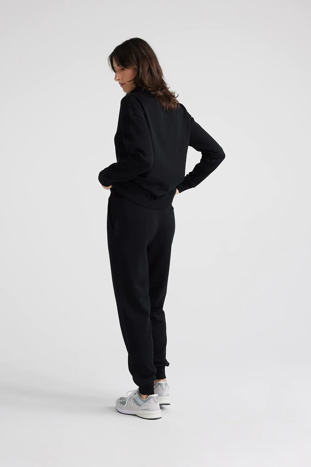 "Upgrade your look with our black Merino wool zip sweater. Exceptional comfort, impeccable style.