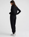 "Upgrade your look with our black Merino wool zip sweater. Exceptional comfort, impeccable style.