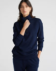 "Elevate your wardrobe with our navy Merino wool sweater. Zip collar adds a modern twist to classic elegance