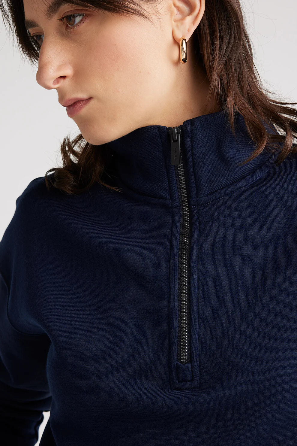 Experience unparalleled comfort in our navy blue Merino wool zip sweater. Perfect blend of style and warmth.