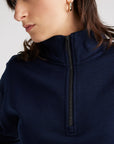 Experience unparalleled comfort in our navy blue Merino wool zip sweater. Perfect blend of style and warmth.