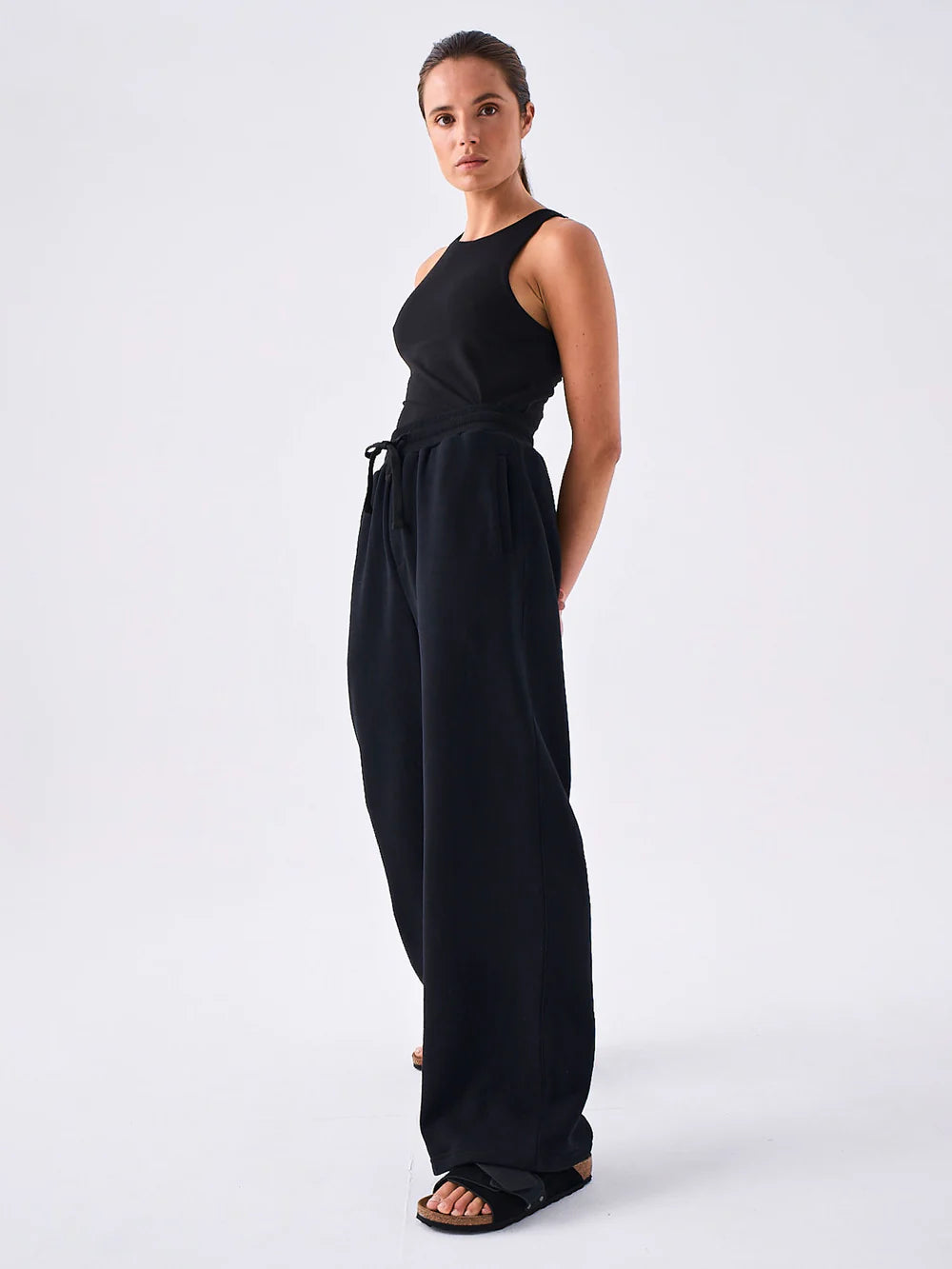 Elevate comfort with our sleek black wide-leg sweat pants. Perfect blend of style and coziness. Shop now!