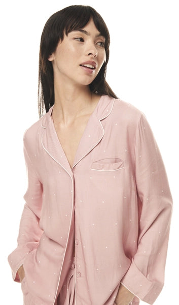 Experience blissful sleep in bamboo pajamas, adorned with charming pink polka dots. Eco-friendly comfort awaits!