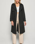 Embrace timeless elegance with our black trench coat. Perfectly tailored for any occasion. Enhance your wardrobe today