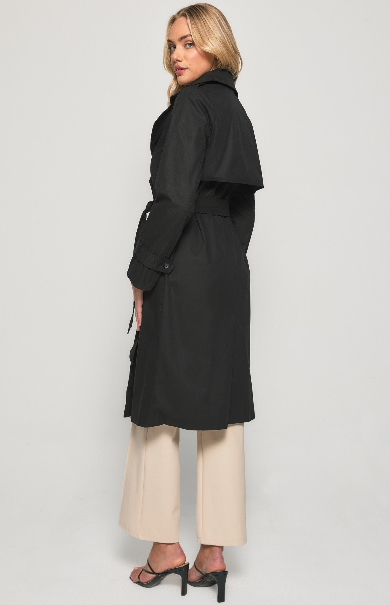 Stay stylish with our black trench coat – the perfect blend of elegance and practicality. Ideal for any occasion
