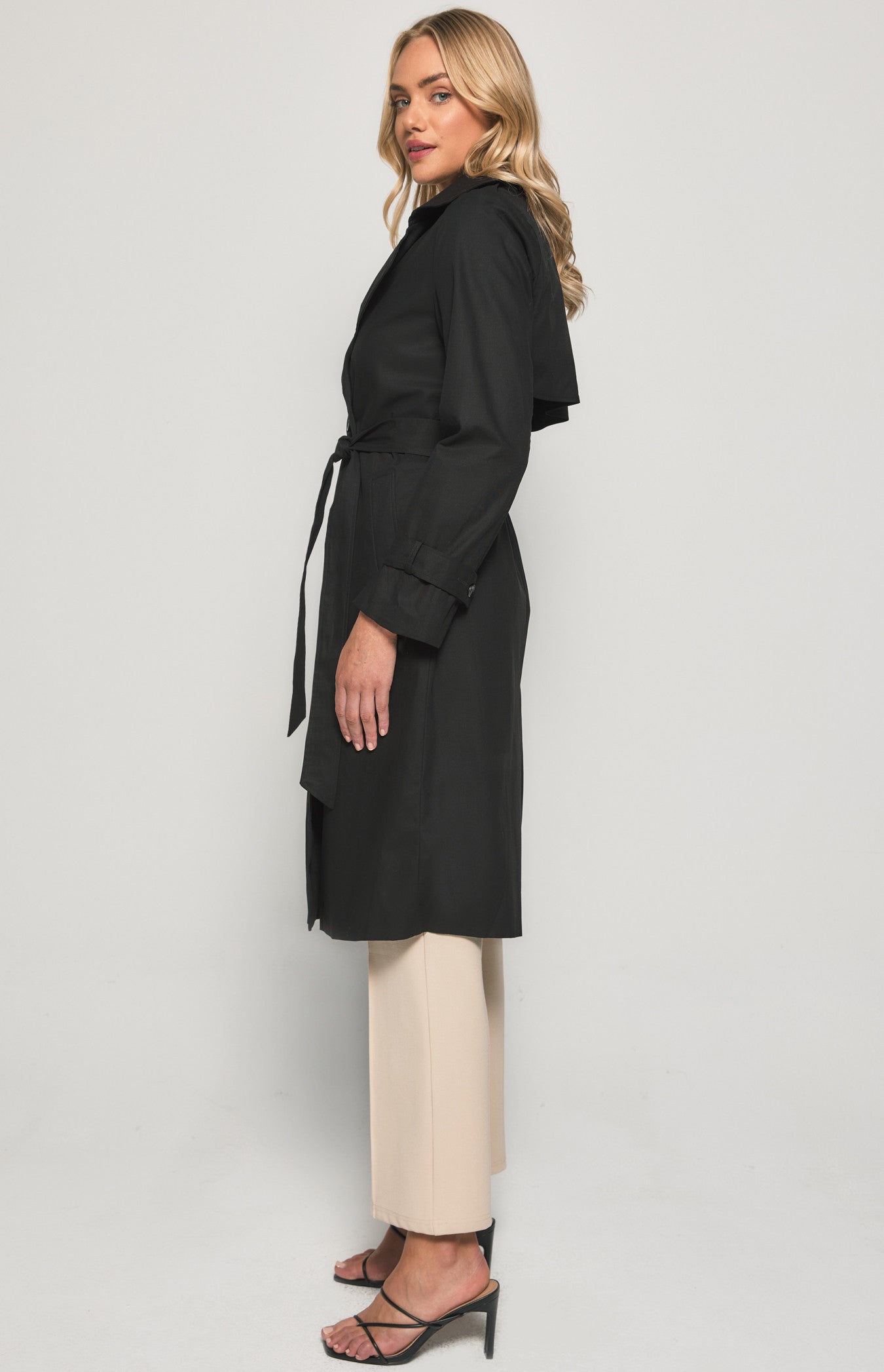 Transform your look with our chic black trench coat. Stylish, durable, and perfect for all seasons. Grab yours today and make a statement. Shop now!